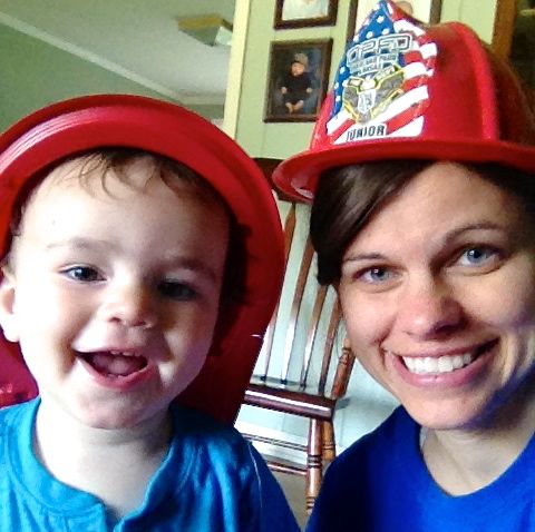 mom and son wearing fire fighter hats