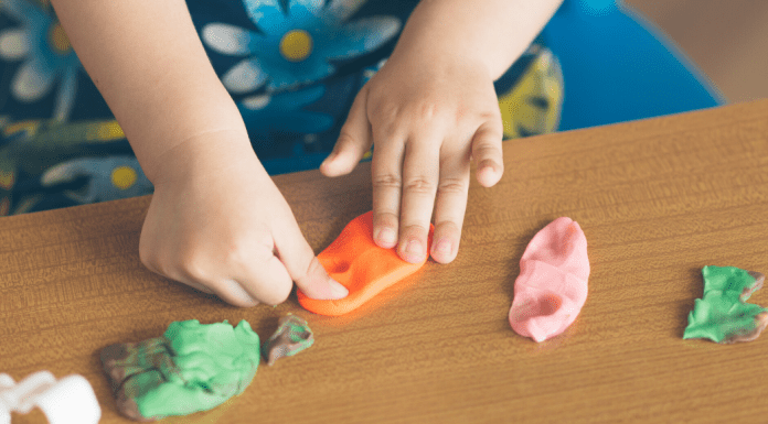 child playing with clay
