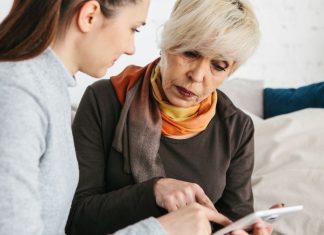 pic of woman with aging mother looking at tablet