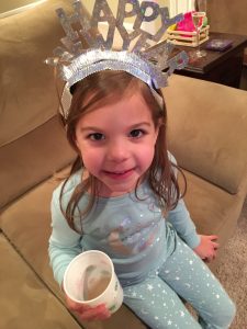 little girl with happy new year eve hat