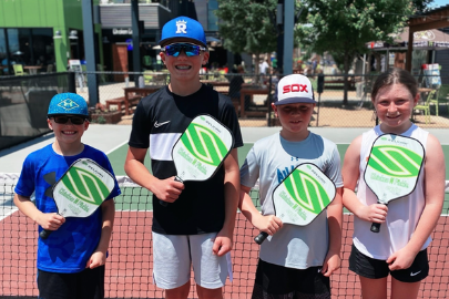 kids with pickle ball rackets