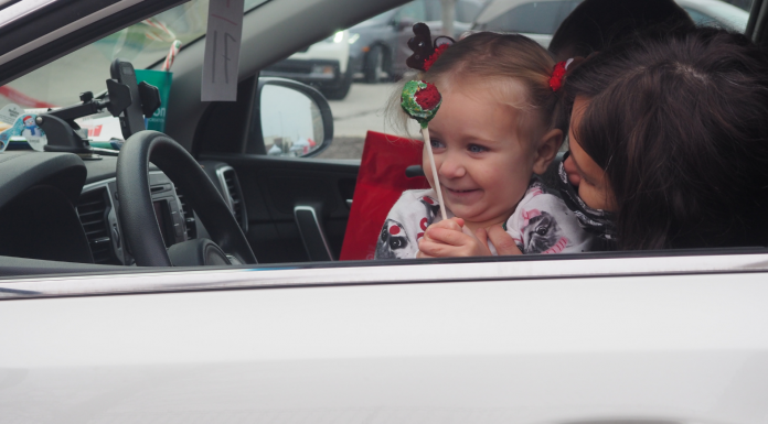 little girl at drive thru Santa