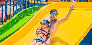 dad and son on water slide