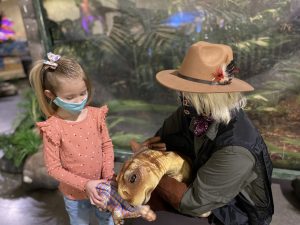 dinosaur trainer with baby Dino and kid