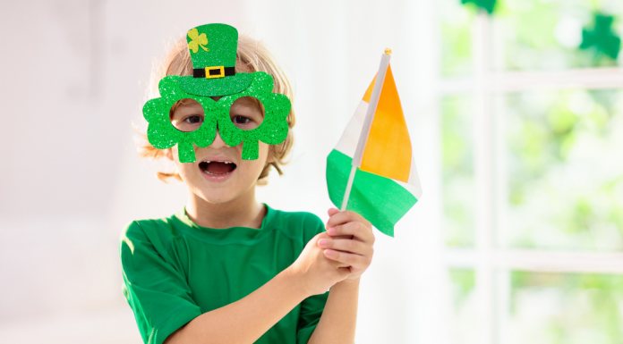 kid with Irish flag and St Patrick's Day glasses