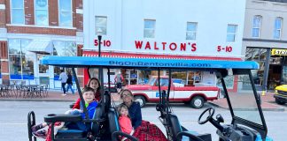 family on cart outside Waltons in Bentonville