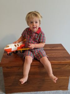 little boy with toy plane