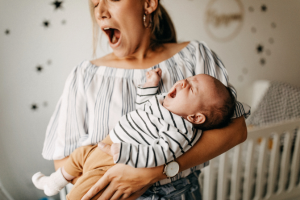 mom and baby yawning
