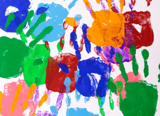 painted kid hands on paper