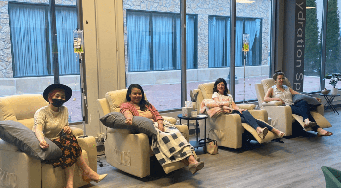 women in chairs at hydration spa