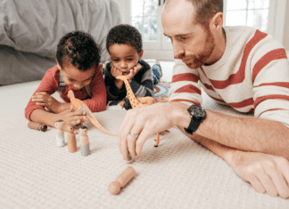 dad playing blocks with two boys