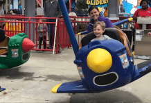 mom and kid riding plane ride at Worlds of Fun