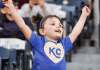 little girl cheering for Royals at Kauffman Stadium