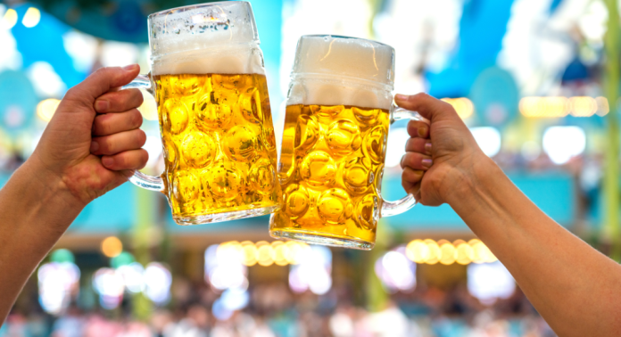 Couple toasting with big beer steins
