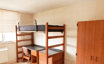 college dorm room with bed