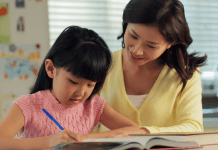 mom with girl writing in notebook
