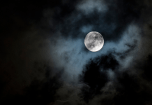 spooky clouds around moon